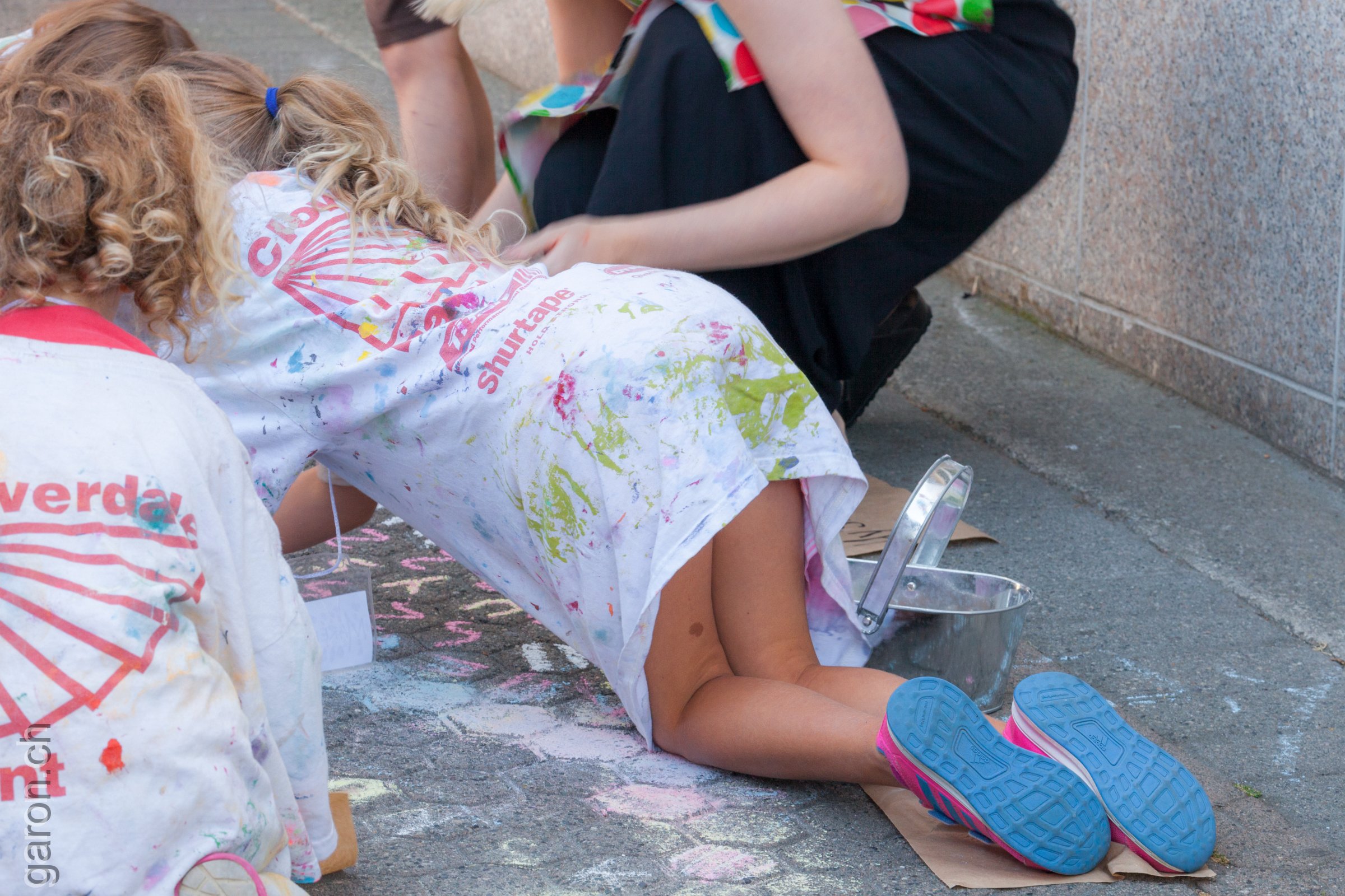 British Columbia, Nanaimo Children draw with chalk on the sidewalk